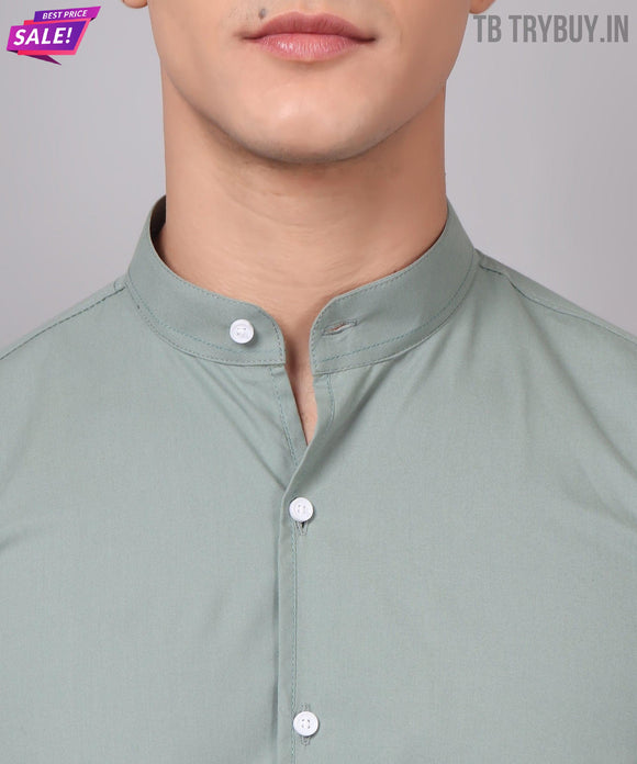 a close up of a person wearing a green shirt
