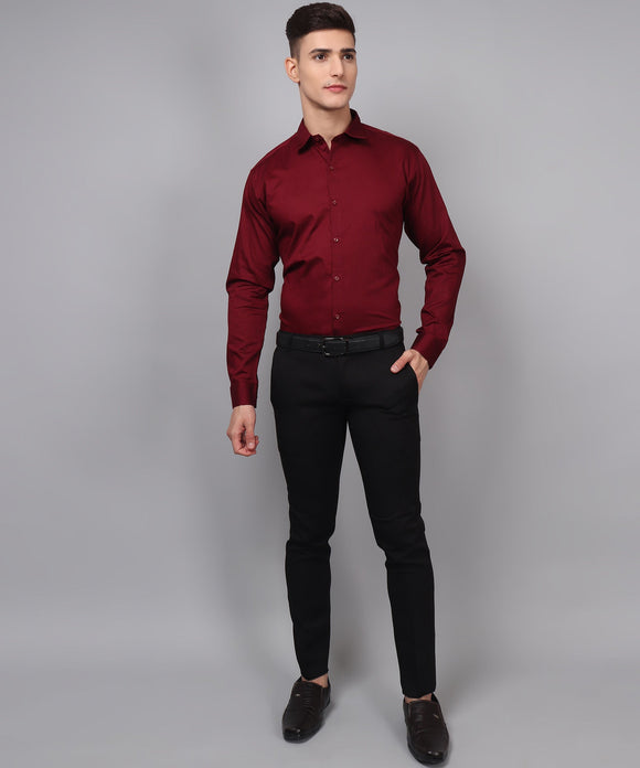 a man in a red shirt and black pants
