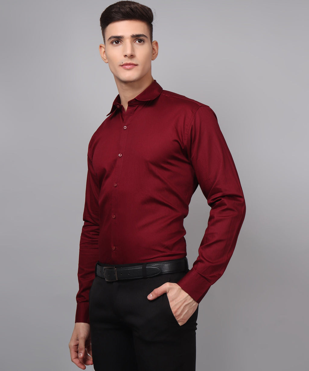 a man wearing a red shirt and black pants