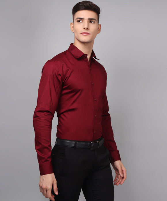 a man wearing a red shirt and black pants