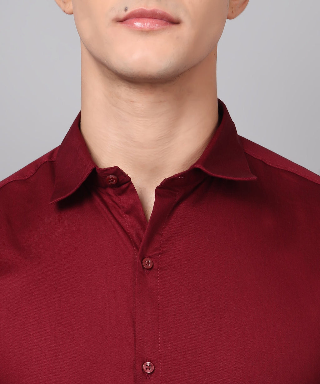 a man wearing a red shirt and glasses