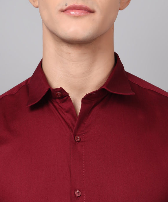 a man wearing a red shirt and glasses