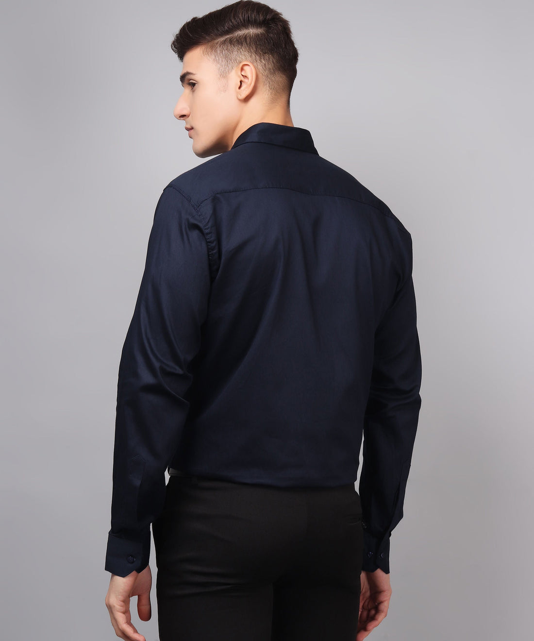 a man wearing a black shirt and black pants