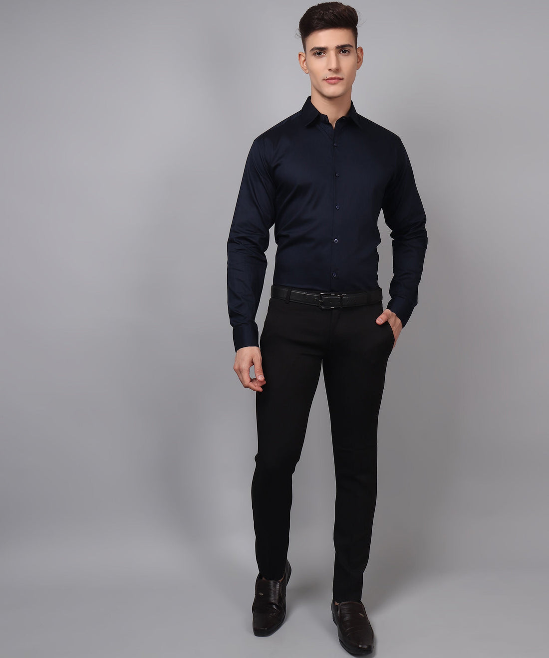 a man in a black shirt and black pants