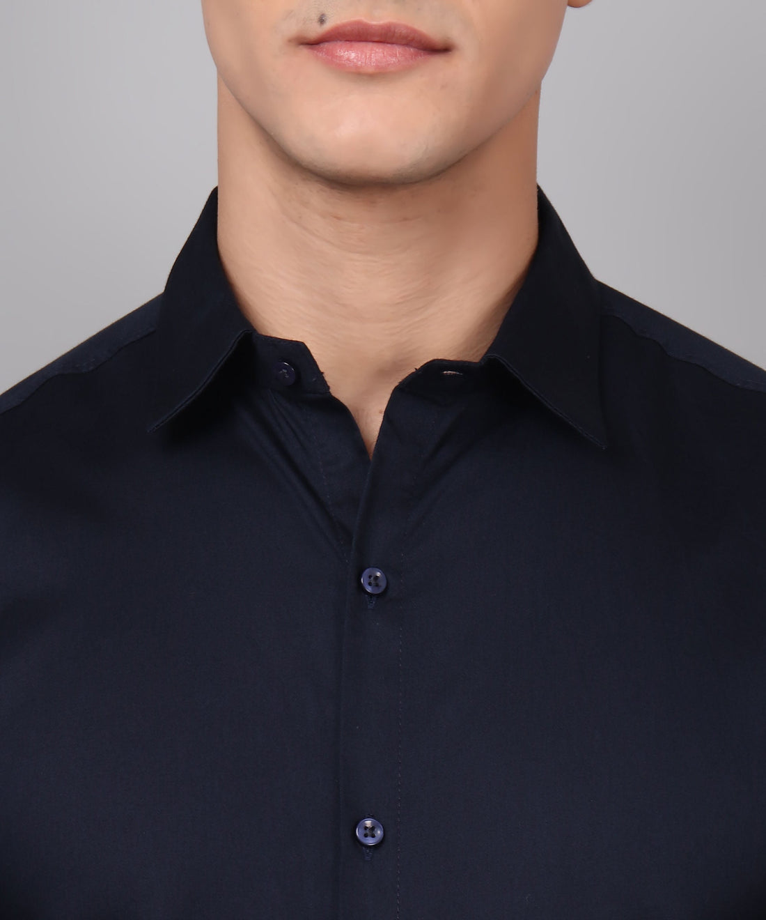 a man wearing a black shirt and glasses