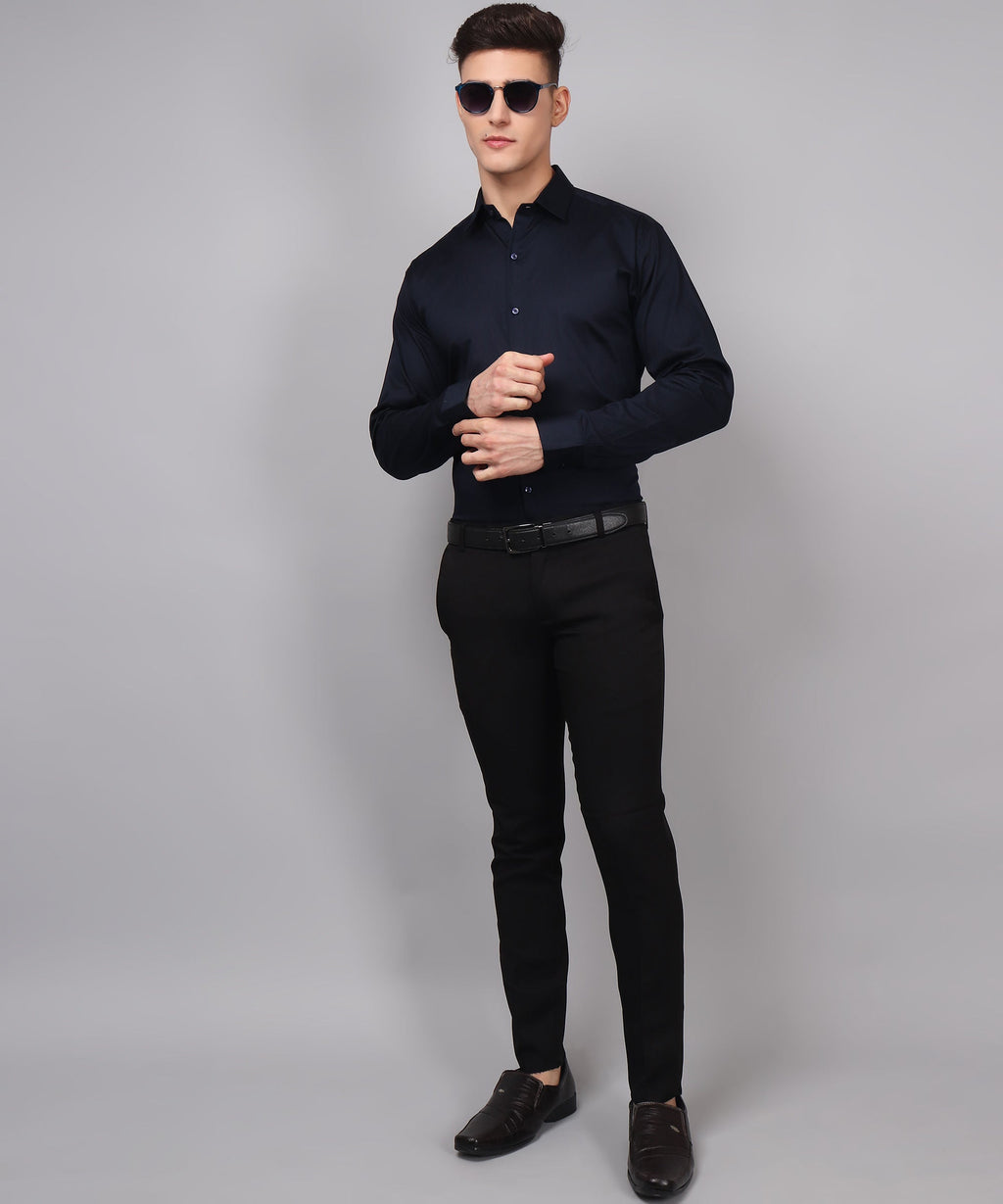 a man in a black shirt and black pants