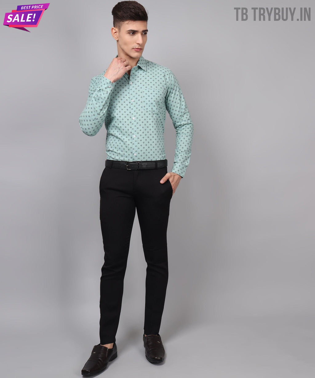 a man in a green shirt and black pants