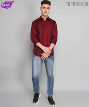 a man in a red shirt and jeans