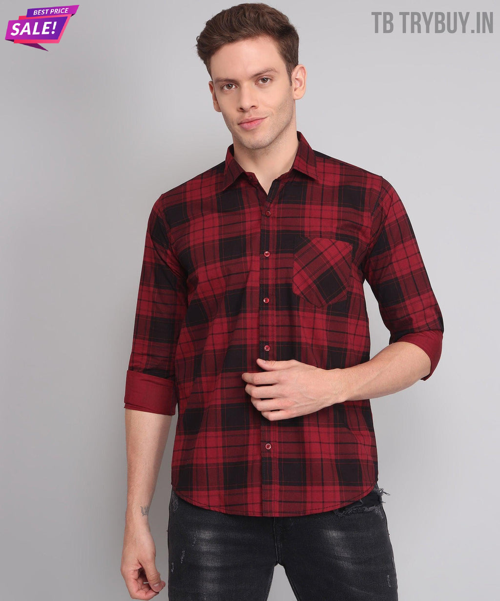 a man wearing a red and black plaid shirt
