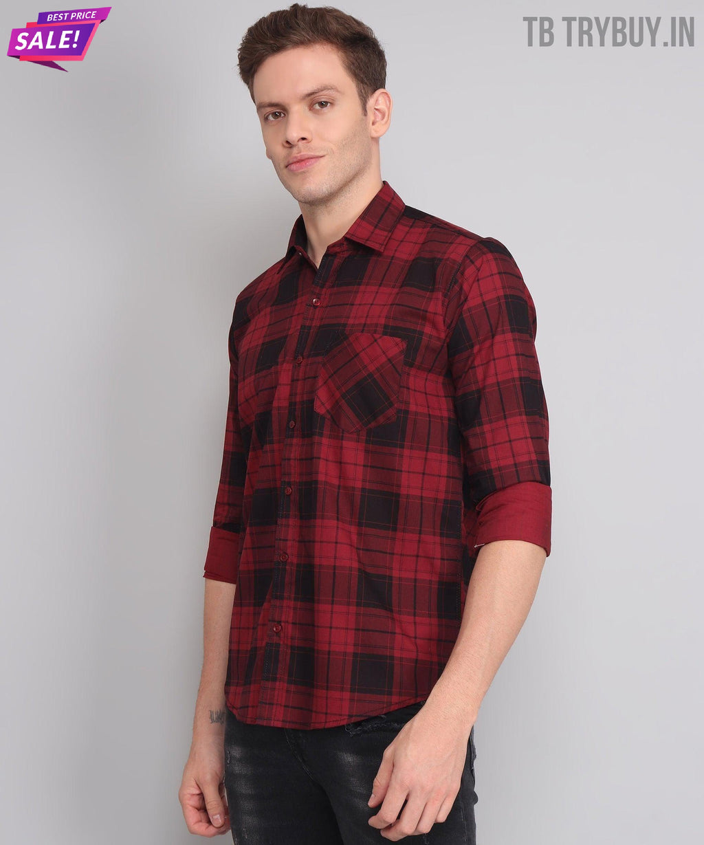 a man wearing a red and black plaid shirt