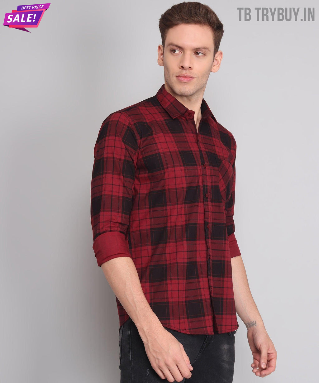 a man wearing a red and black plaid shirt