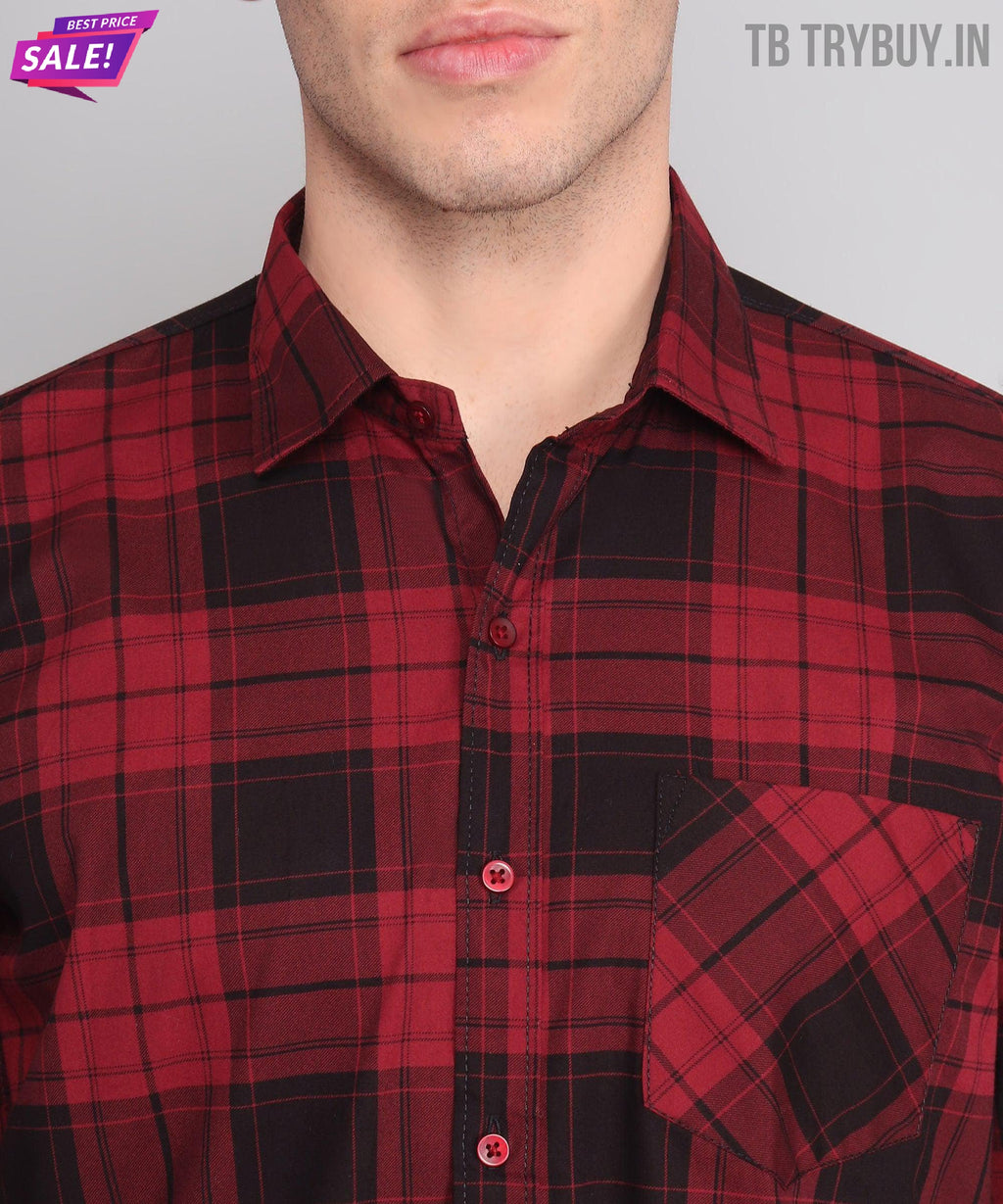 a man wearing a red and black plaid shirt