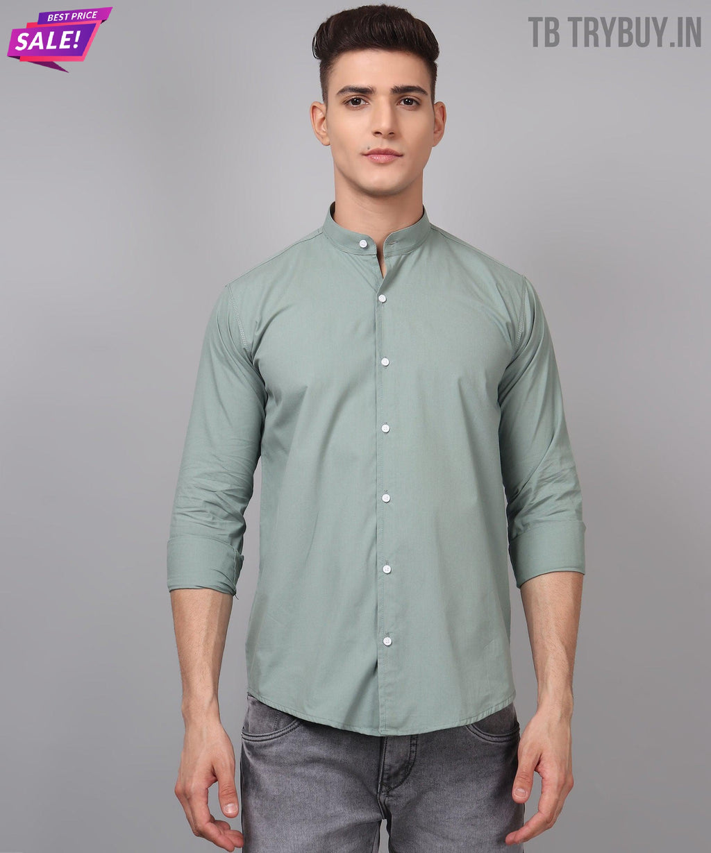 a man wearing a green shirt and jeans