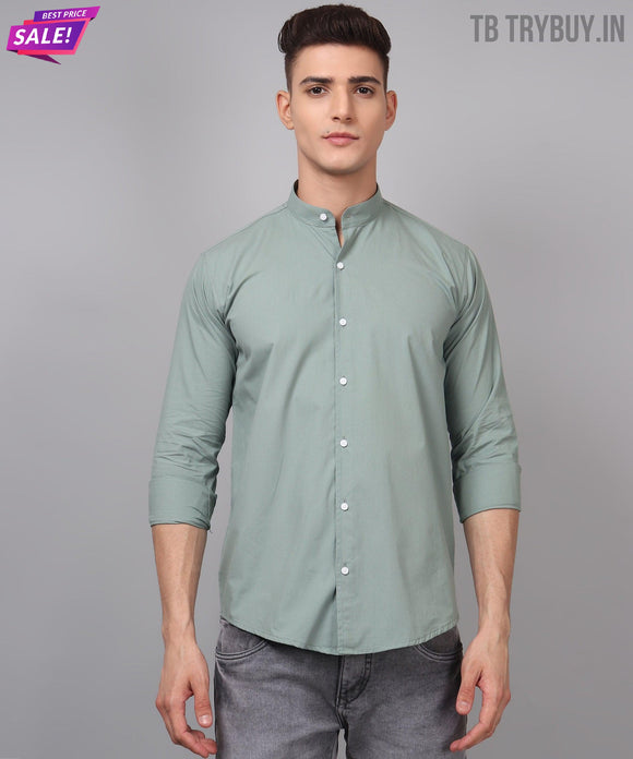 a man wearing a green shirt and jeans