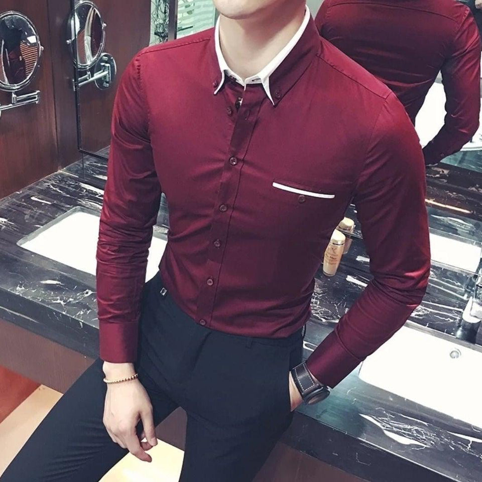 a man wearing a red shirt and black pants