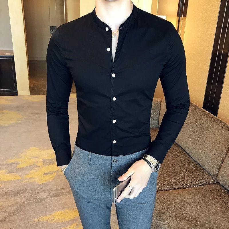 a man wearing a black shirt and grey pants