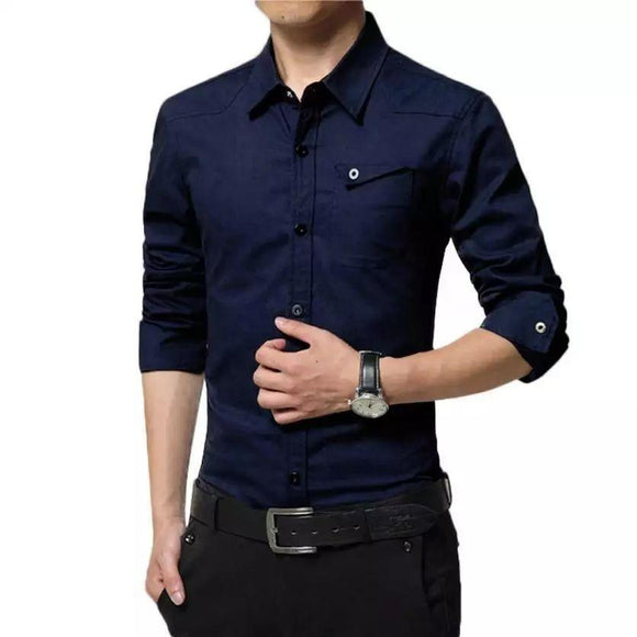 a man wearing a blue shirt and black pants
