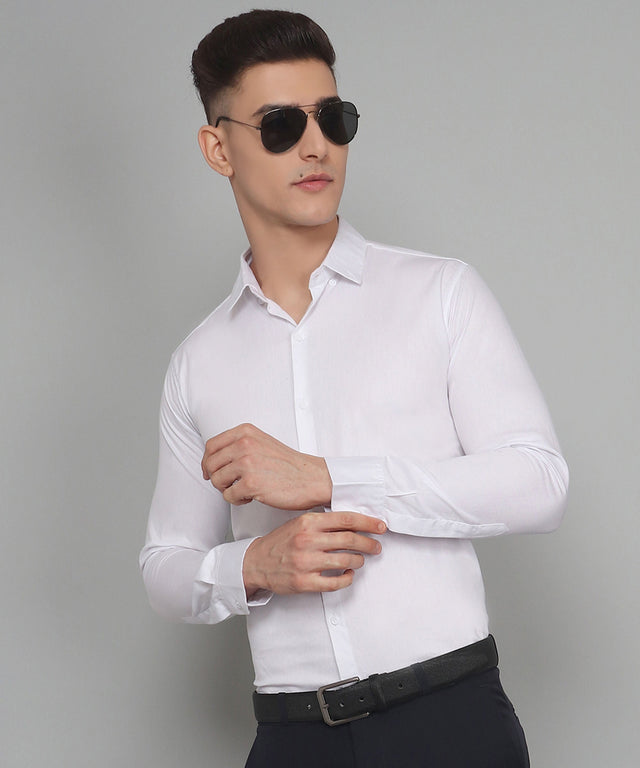 
a man wearing a white shirt and black pants
