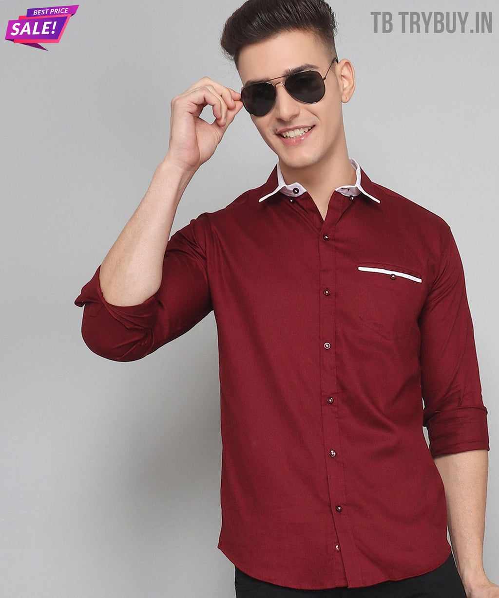 a man wearing a red shirt and sunglasses