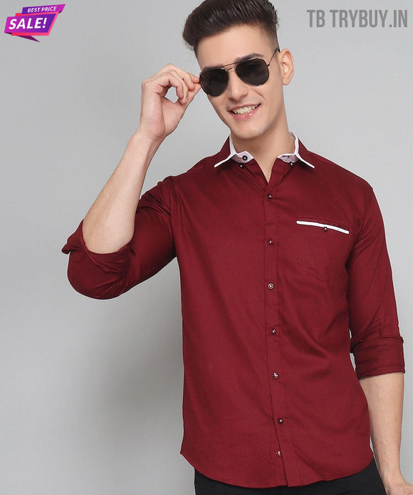 a man wearing a red shirt and sunglasses