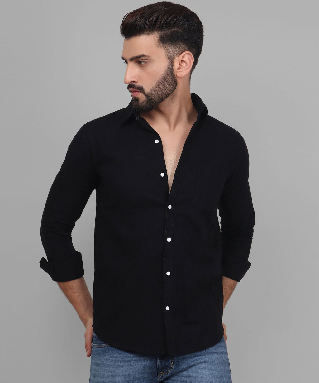 a man wearing a black shirt and jeans