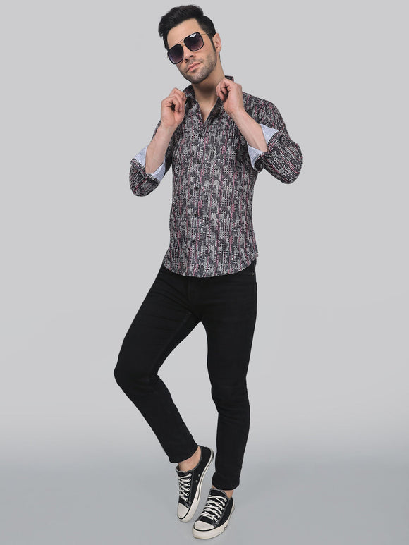 a man in a shirt and black pants posing for a picture