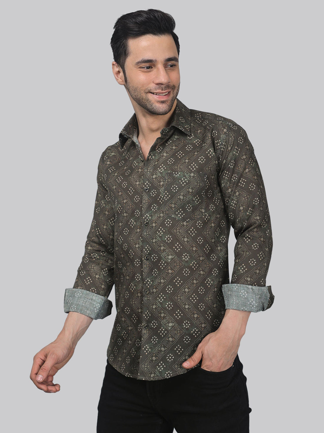 
a man wearing a brown shirt and black pants
